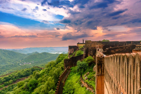 Sunset View of Jaigarh Fort, situated on the promontory called the Cheel ka Teela (Hill of Eagles) of the Aravalli range; it overlooks the Amer Fort and the Maota Lake, in Jaipur, Rajasthan, India .